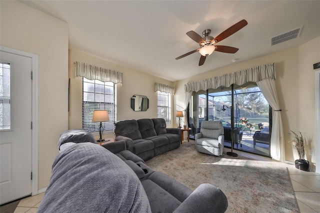 living room with ceiling fan and light tile patterned flooring