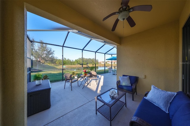 view of patio / terrace with a lanai and ceiling fan