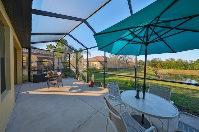 view of patio / terrace with a water view and a lanai