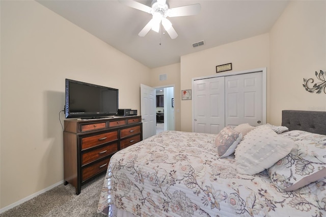 carpeted bedroom with ceiling fan and a closet