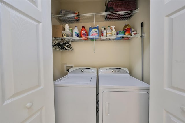 laundry area with separate washer and dryer