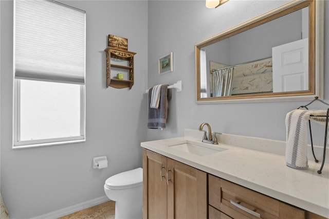 bathroom with a shower with curtain, tile patterned flooring, vanity, and toilet