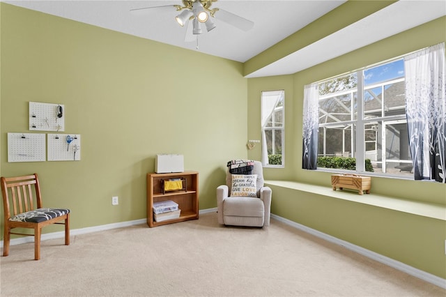 sitting room featuring ceiling fan and light colored carpet