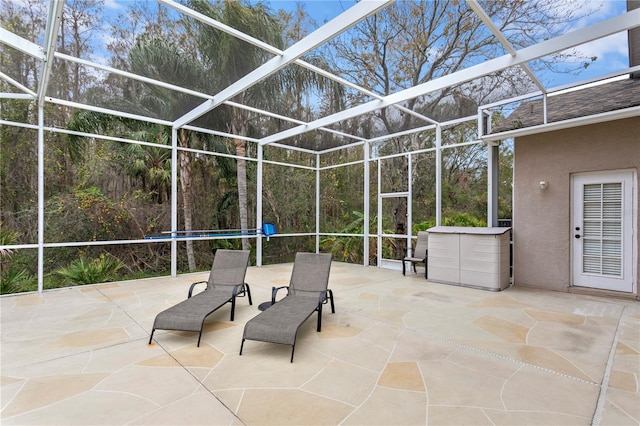 view of patio / terrace featuring a lanai