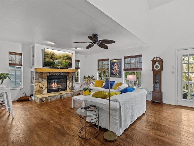 living room with ceiling fan, a fireplace, and hardwood / wood-style floors