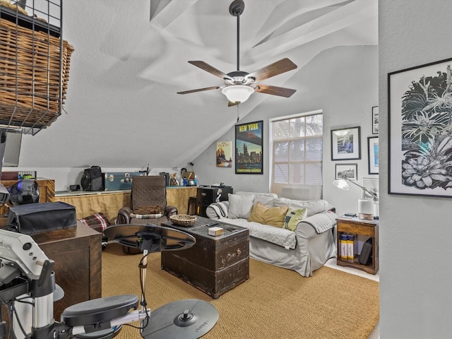 living room with ceiling fan, lofted ceiling, and carpet flooring