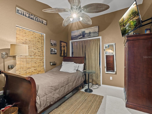 carpeted bedroom featuring ceiling fan