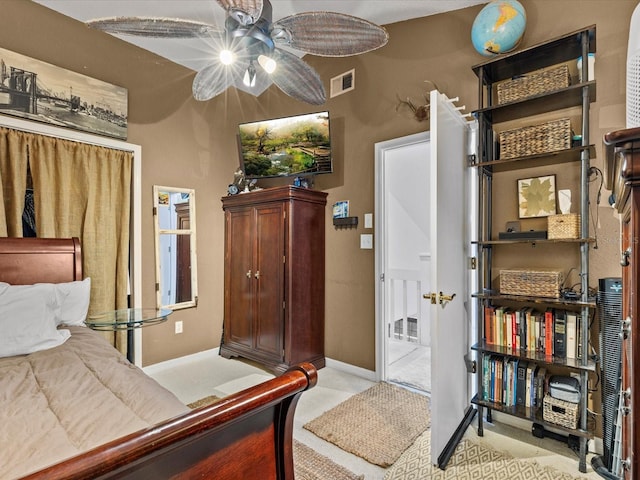 bedroom featuring ceiling fan and light colored carpet