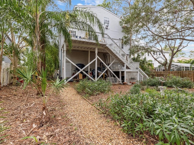 rear view of house with a wooden deck