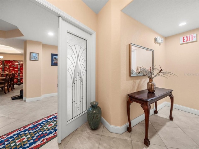 foyer with light tile patterned floors