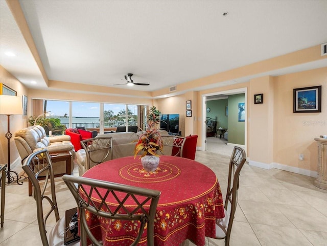 dining room featuring ceiling fan and light tile patterned floors