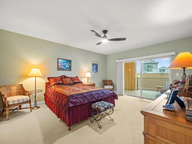 bedroom featuring light colored carpet, ceiling fan, and access to exterior