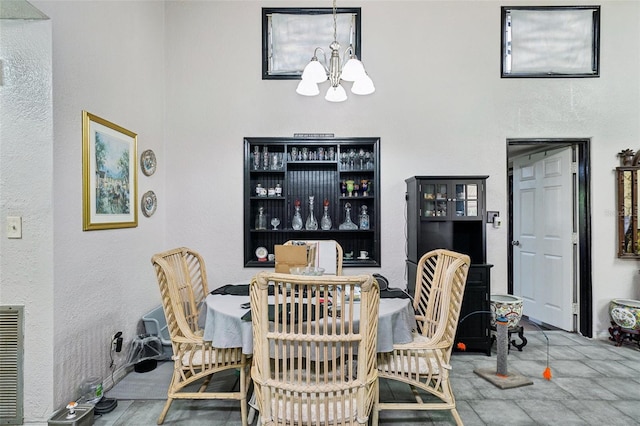 dining area featuring a chandelier