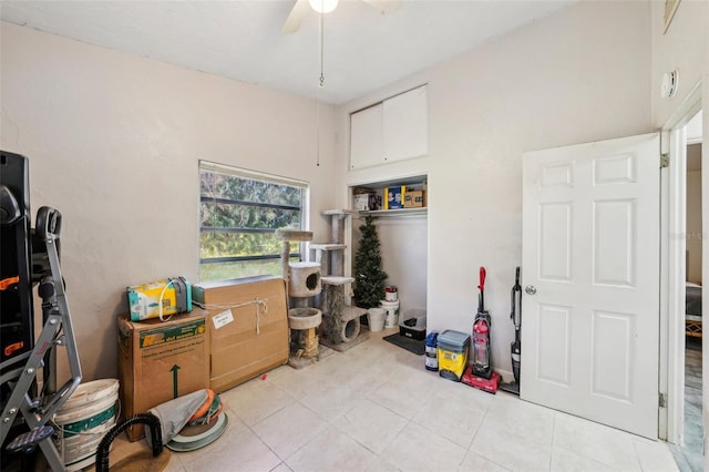 miscellaneous room featuring light tile patterned floors and ceiling fan