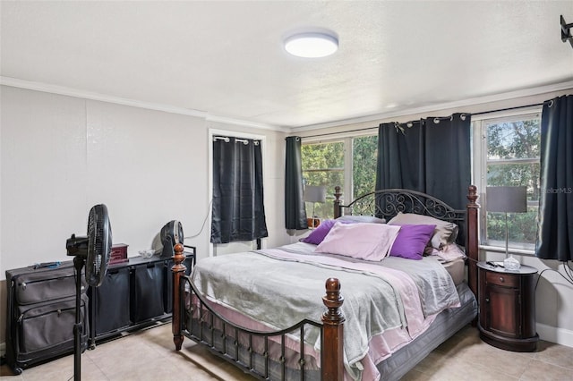 bedroom featuring crown molding, light tile patterned flooring, and multiple windows