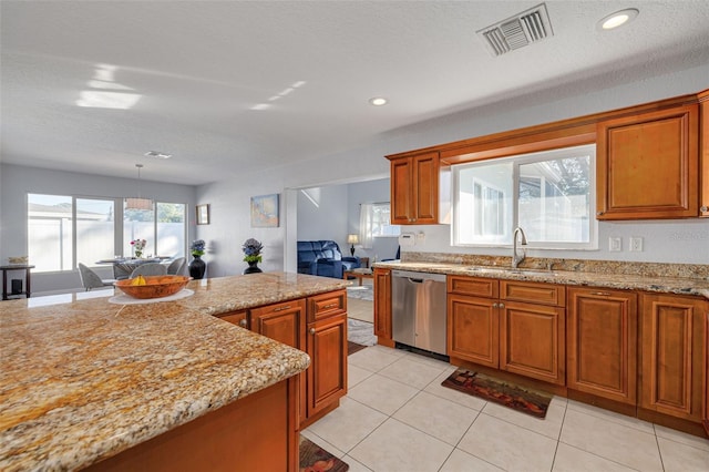 kitchen with light stone countertops, sink, decorative light fixtures, dishwasher, and light tile patterned flooring