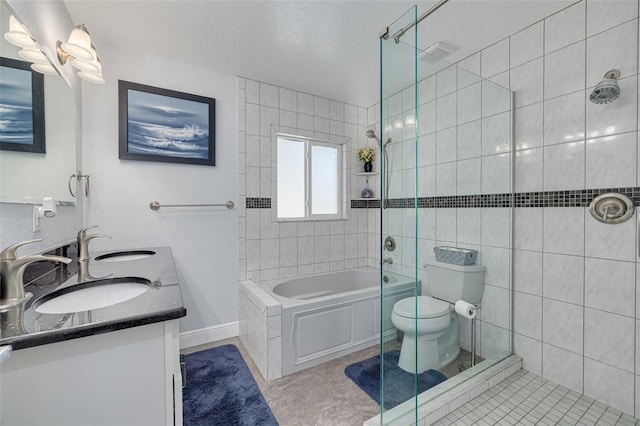 full bathroom featuring tile patterned floors, a textured ceiling, vanity, independent shower and bath, and toilet