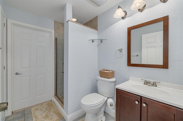 bathroom featuring an enclosed shower, vanity, a textured ceiling, tile patterned flooring, and toilet