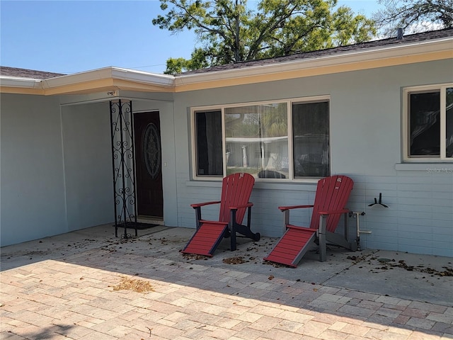 property entrance featuring a patio