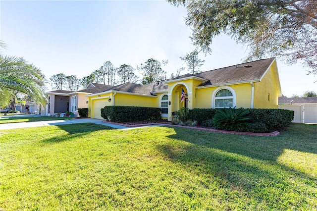 ranch-style house with a garage and a front lawn