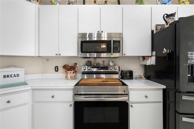 kitchen featuring white cabinetry and stainless steel appliances