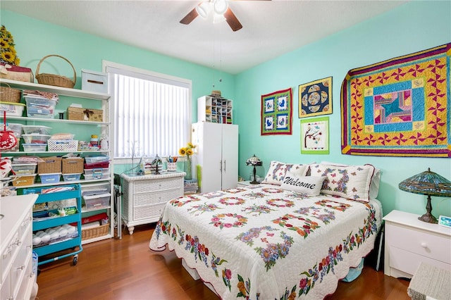 bedroom featuring ceiling fan and dark hardwood / wood-style flooring