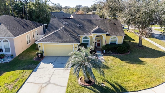 ranch-style home featuring a garage and a front yard