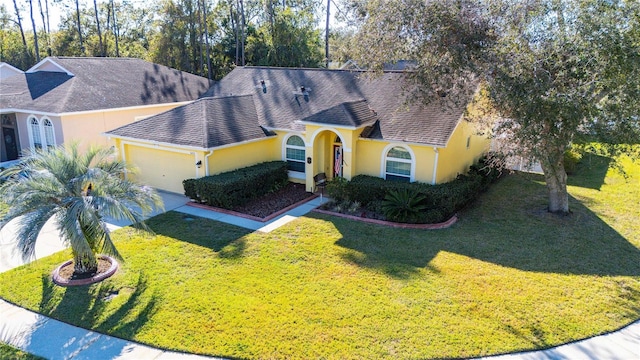 5215 New Brittany Ln, Zephyrhills, FL 33541 - view of front of house with stucco siding, a front lawn, an attached garage, concrete driveway, and a shingled roof