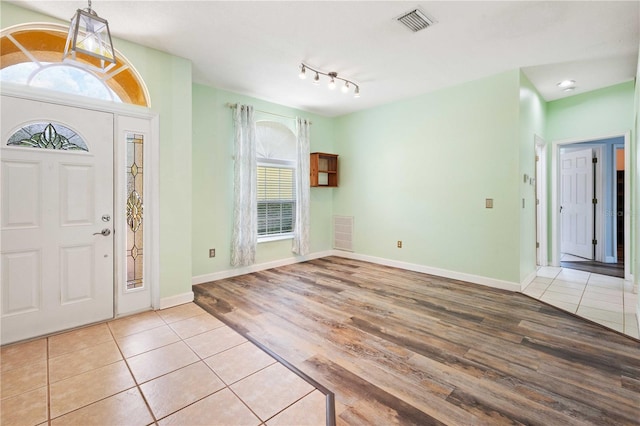 5215 New Brittany Ln, Zephyrhills, FL 33541 - foyer entrance featuring wood finished floors and baseboards