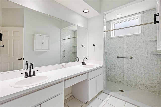 5215 New Brittany Ln, Zephyrhills, FL 33541 - bathroom with a shower stall, double vanity, tile patterned flooring, and recessed lighting