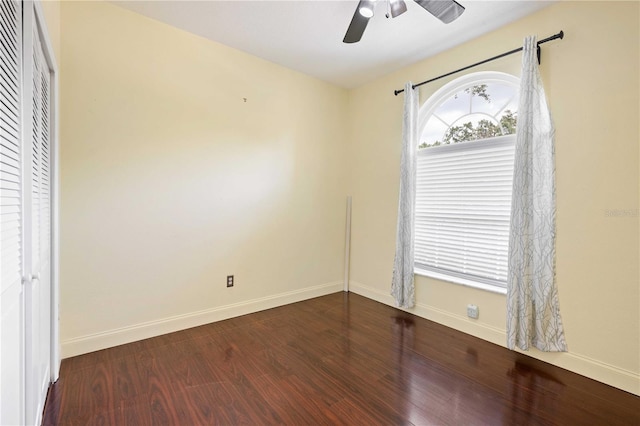 5215 New Brittany Ln, Zephyrhills, FL 33541 - unfurnished bedroom featuring wood finished floors, baseboards, a closet, and a ceiling fan