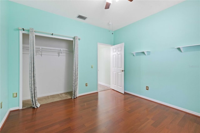 5215 New Brittany Ln, Zephyrhills, FL 33541 - unfurnished bedroom with wood finished floors, a closet, and baseboards