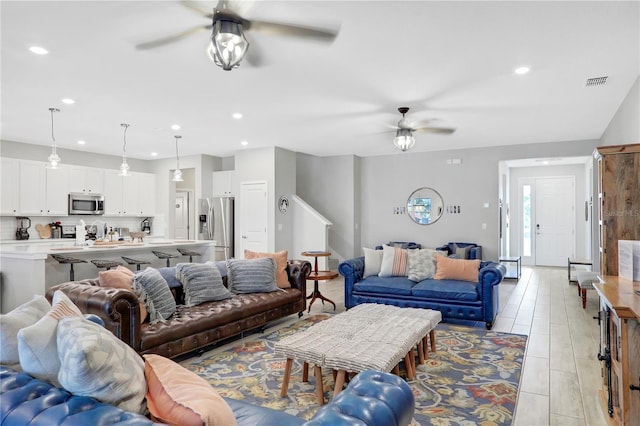 living room featuring ceiling fan