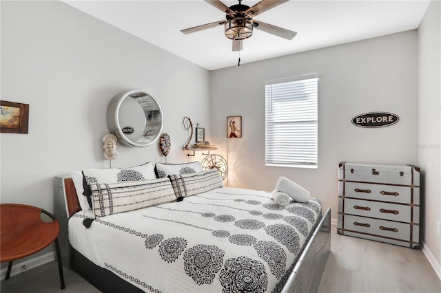 bedroom with ceiling fan and light hardwood / wood-style floors