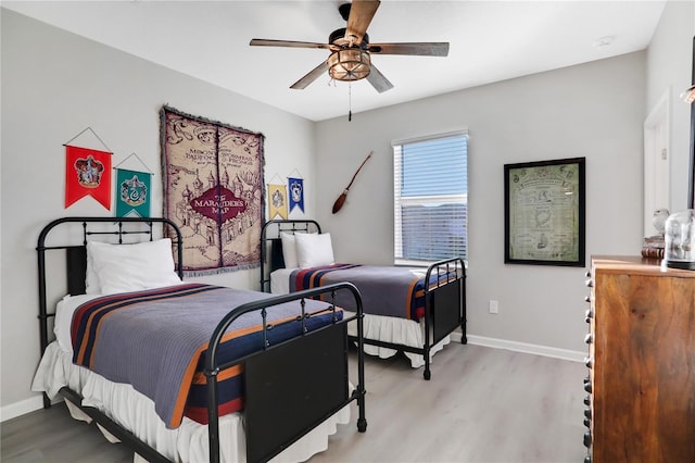 bedroom with light wood-type flooring and ceiling fan