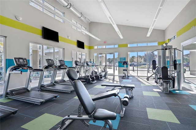 gym with a towering ceiling