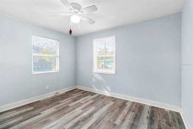 empty room with wood-type flooring and ceiling fan