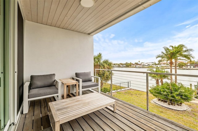 balcony featuring a water view