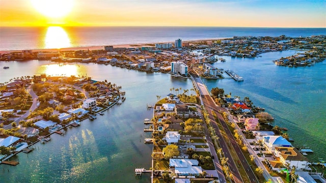 aerial view at dusk with a water view