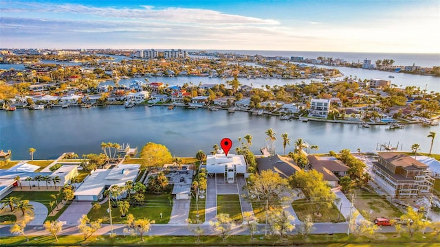 birds eye view of property featuring a water view