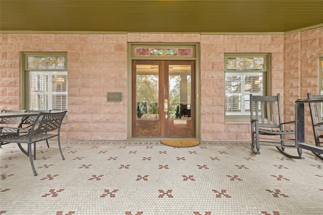 property entrance featuring french doors