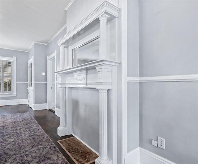 room details featuring hardwood / wood-style flooring, decorative columns, and ornamental molding