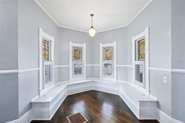 interior space with plenty of natural light, dark hardwood / wood-style floors, and crown molding