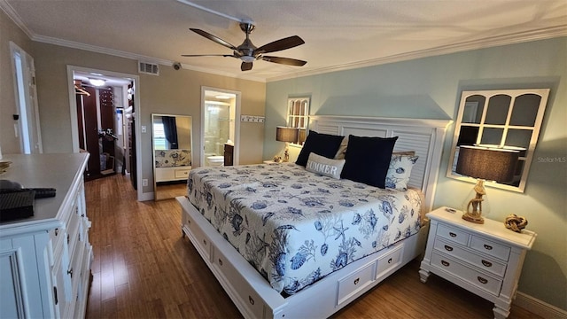 bedroom featuring crown molding, dark wood-type flooring, connected bathroom, and ceiling fan