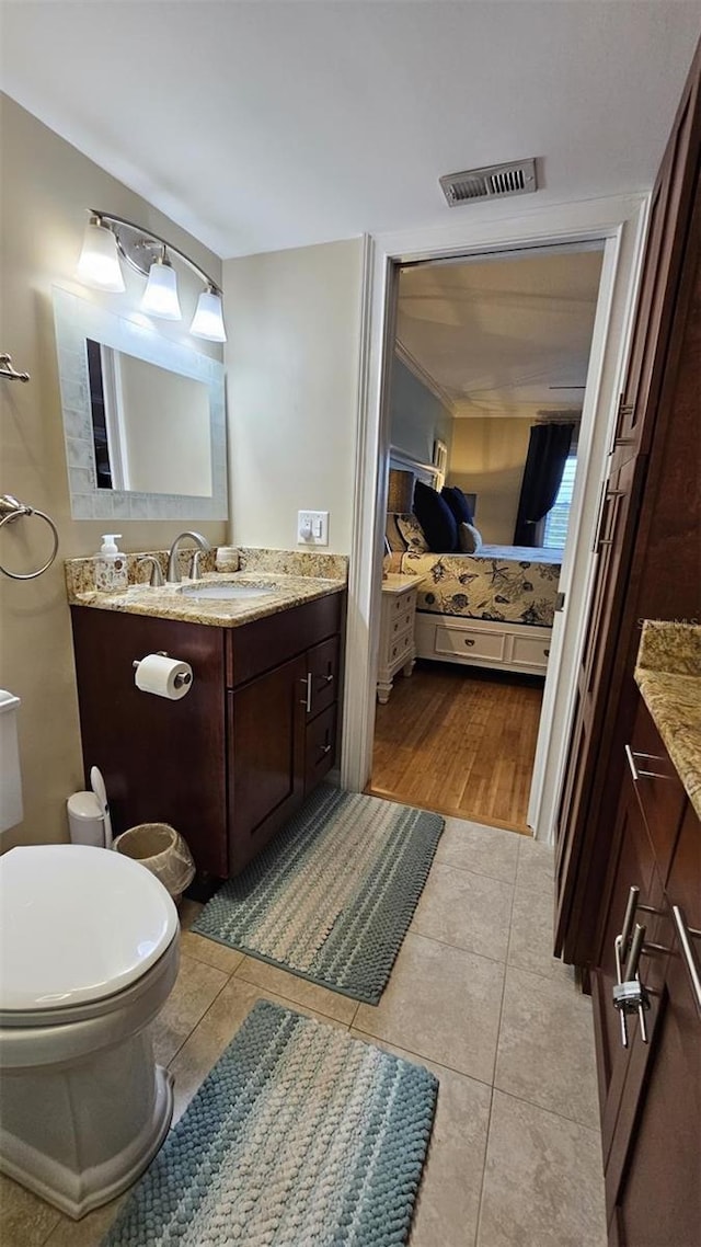 bathroom with tile patterned floors, toilet, and vanity