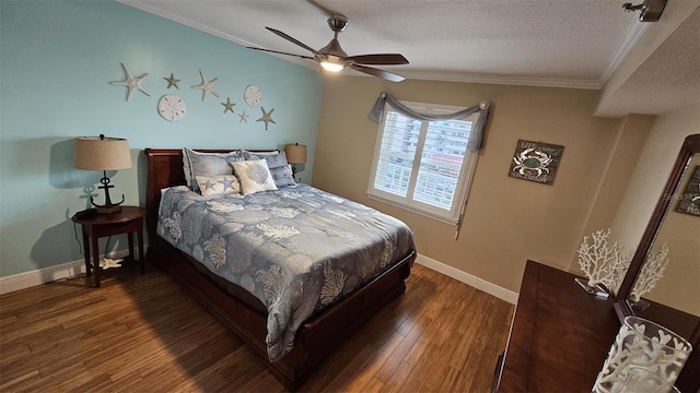 bedroom featuring dark wood-type flooring, ceiling fan, ornamental molding, and a textured ceiling