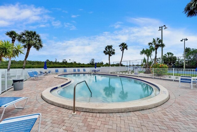 18325 Gulf Blvd Unit 407, Redington Shores, FL 33708 - community pool featuring fence and a patio