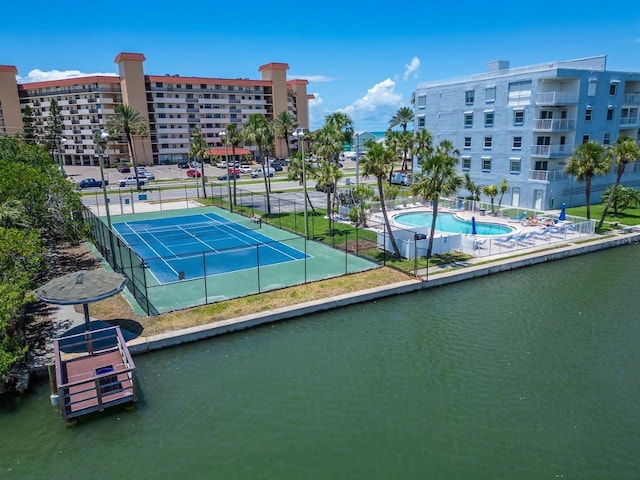 18325 Gulf Blvd Unit 407, Redington Shores, FL 33708 - view of tennis court featuring a water view and fence
