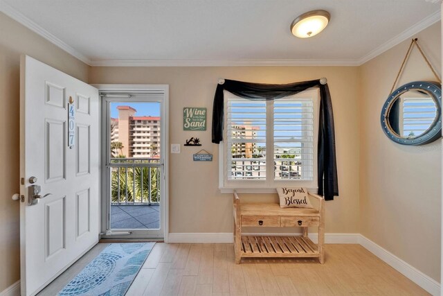 18325 Gulf Blvd Unit 407, Redington Shores, FL 33708 - entrance foyer featuring healthy amount of natural light, wood finished floors, baseboards, and ornamental molding