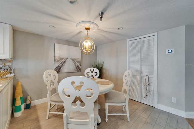 18325 Gulf Blvd Unit 407, Redington Shores, FL 33708 - dining space featuring light wood finished floors, baseboards, a chandelier, and recessed lighting
